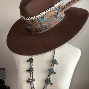 Brown Hat with Feather Accent